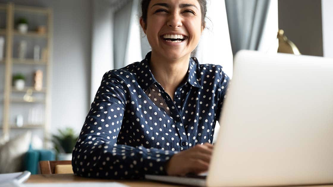 lady smiling at laptop
